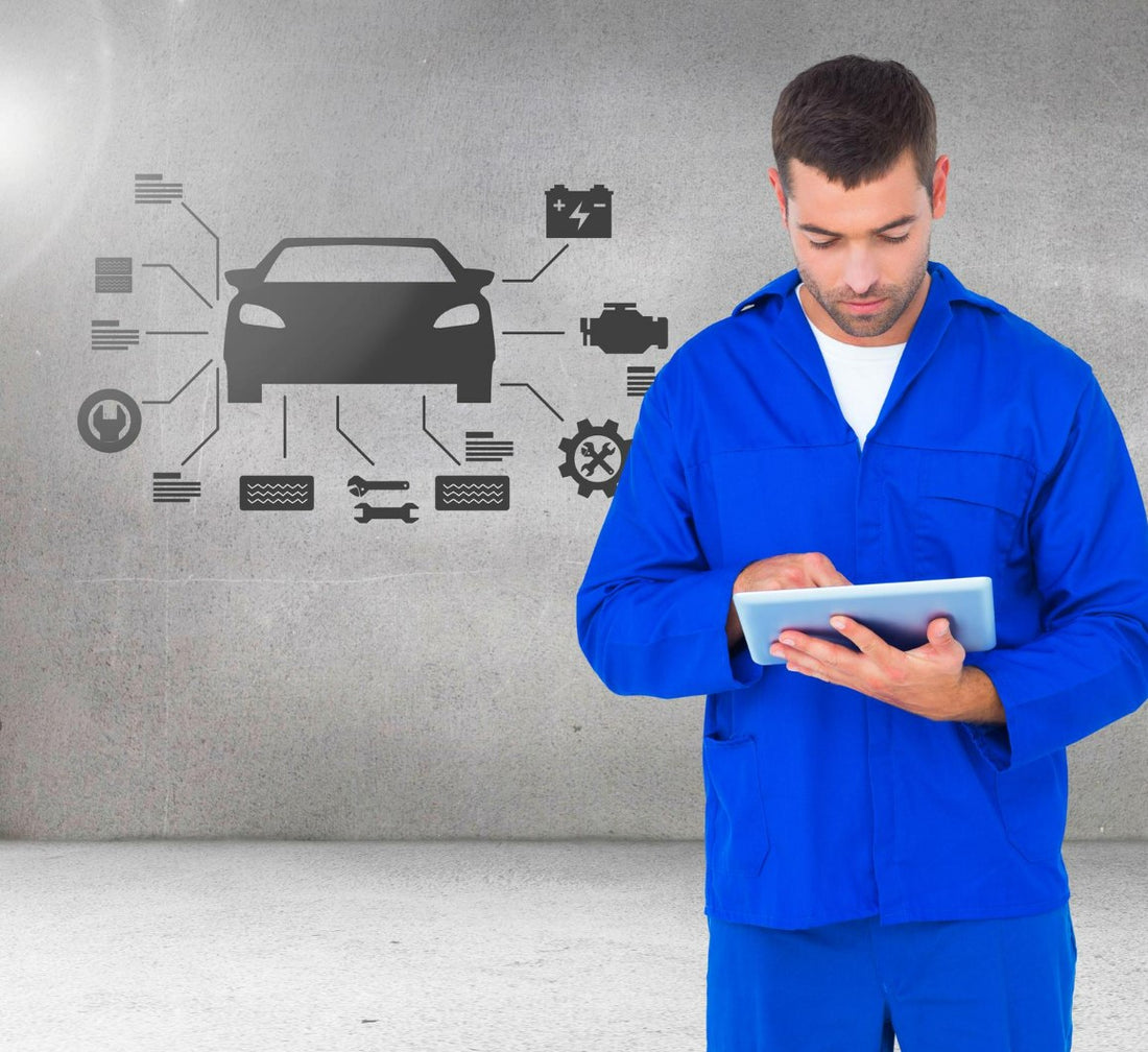 mechanic-using-digital-tablet-against-car-mechanic-interface-background